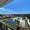 view from a balcony of a pickleball court and a pool in a courtyard