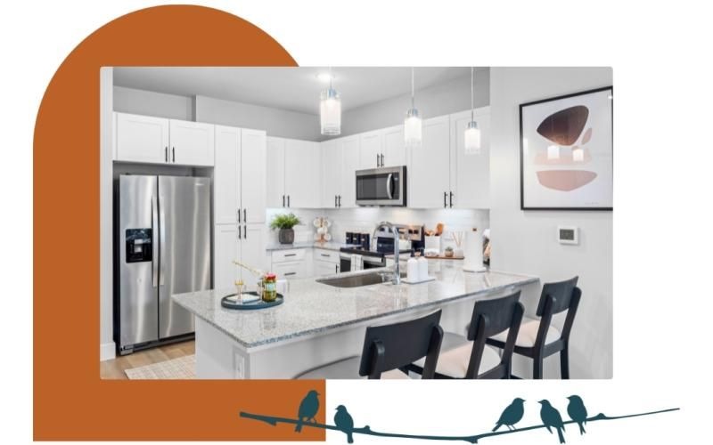 a kitchen with a table and refrigerator