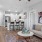 a living room with a couch fan and a table