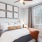 a bedroom with a fan and a bed