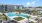 a large building with a pool in front of it