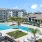 a large building with a pool in front of it